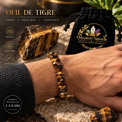 Bracelet œil de tigre porté au poignet avec une manche noire