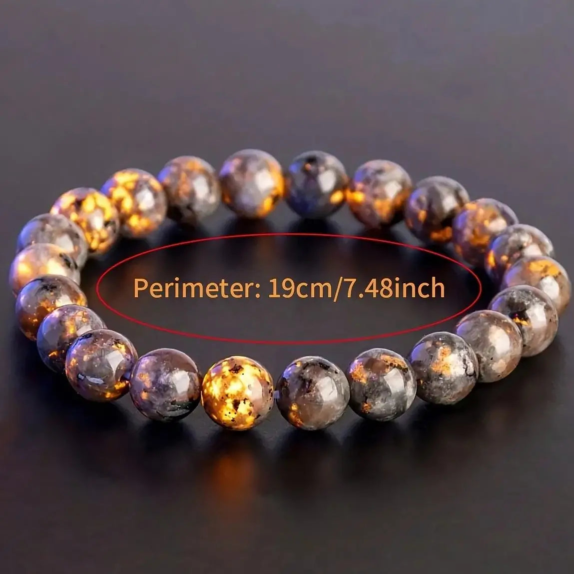 Bracelet Yooperlite avec fluorescence orange et indication d’un périmètre de 19 cm.